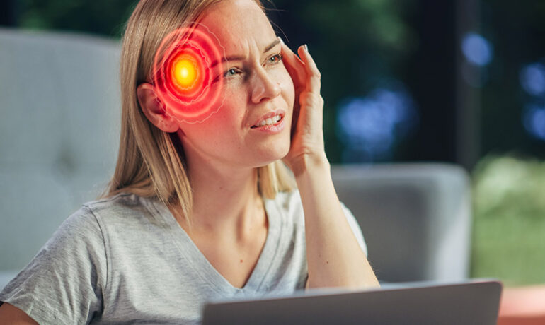 Brain Injury Illustration added to picture of a Female Working on Laptop